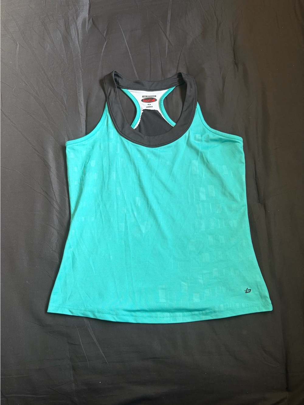 Bolle teal tank top with black trim&subtle rectangle pattern on front. Size M.